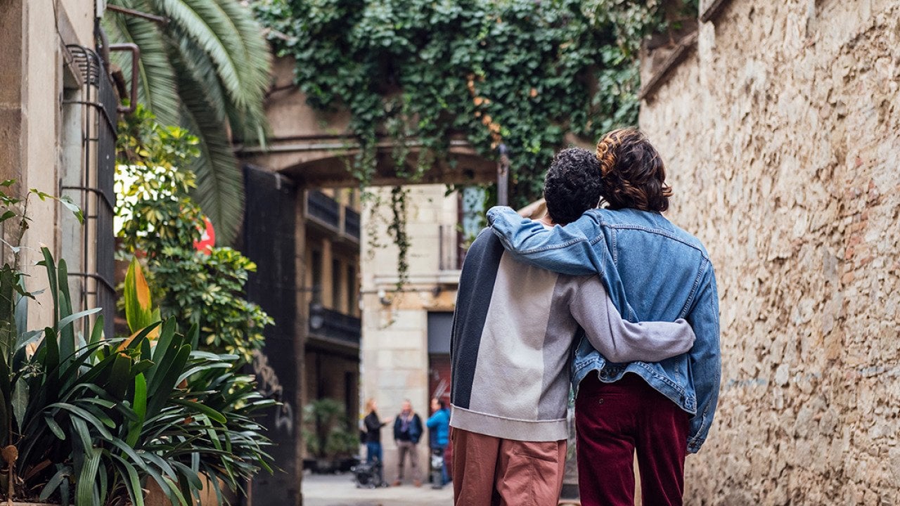 A male couple looking at a sight during a trip.