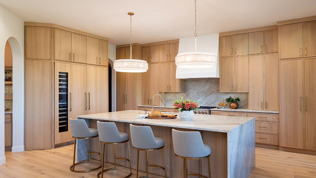 Contemporary kitchen with light wood flooring and cabinets.