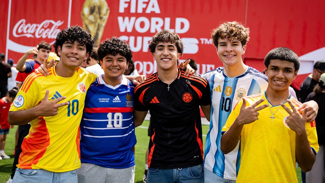 Fans posing for a photo during the FIFA World Cup Trophy Tour 2026 in Miami, Florida, USA.