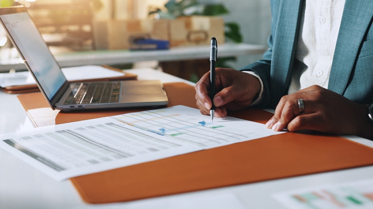 A businessman signing documents.