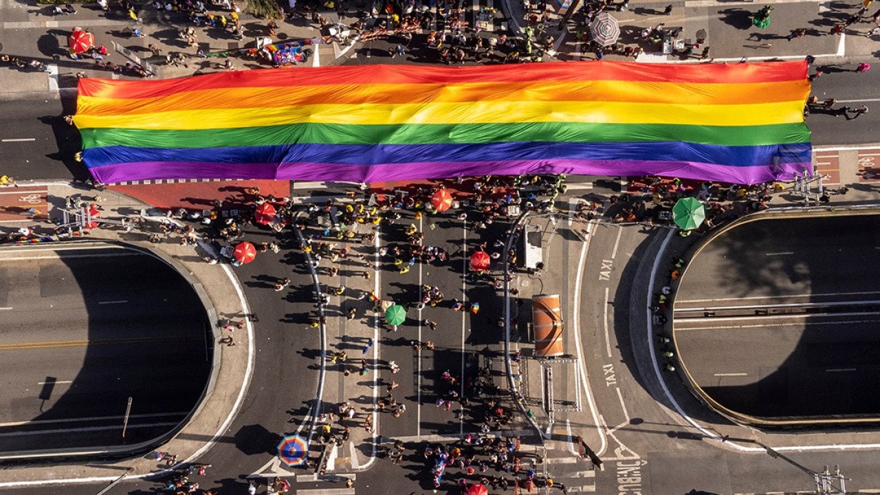 An aerial shot of a massive pride flag from the 28th edition of São Paulo LGBT+ Pride Parade in Brazil.