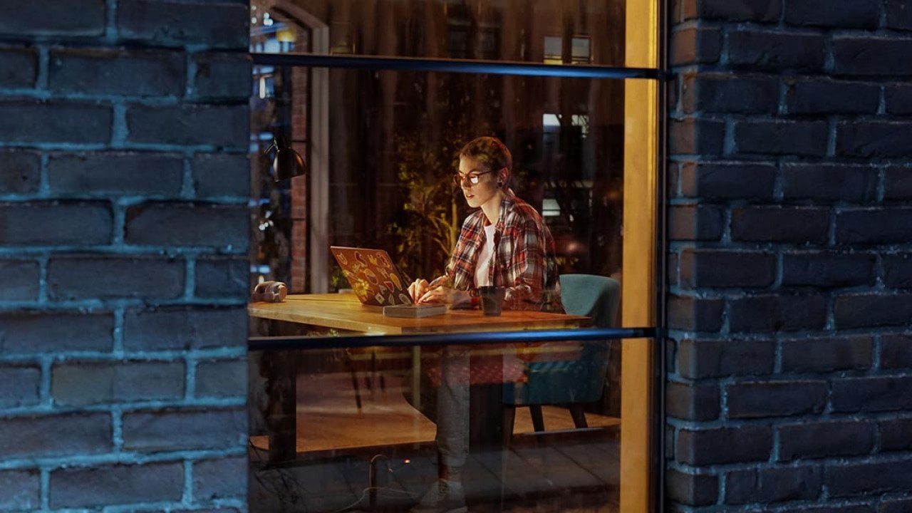 A view from the window of a female creative professional working late at night.