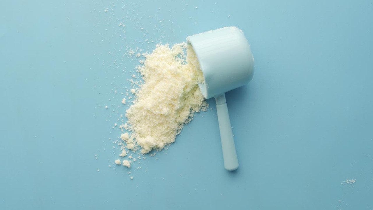 A spilled baby milk powder in a milk scooper.