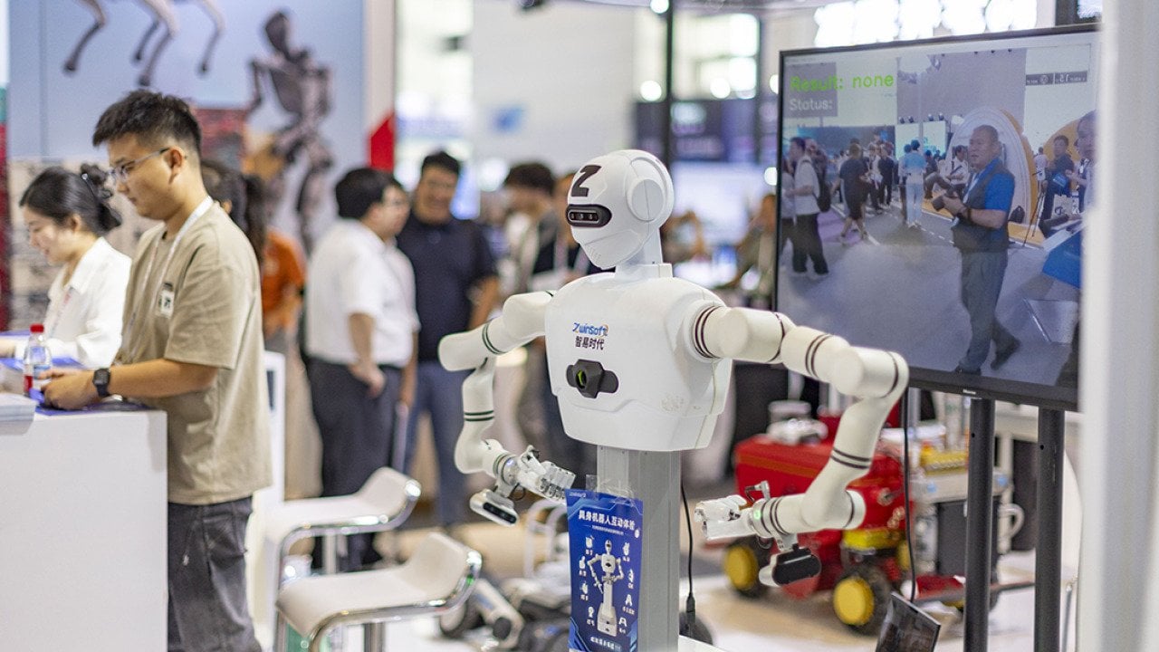 An exhibitor for AI and robot manufacturing during the 2026 World Intelligent Industry Expo in Tianjin, China.