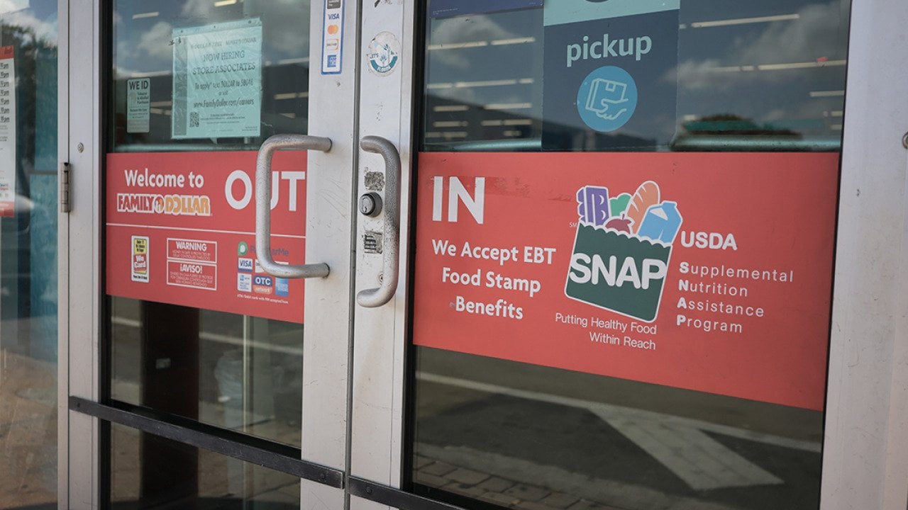 A store with signage indicating that it accepts SNAP benefits.