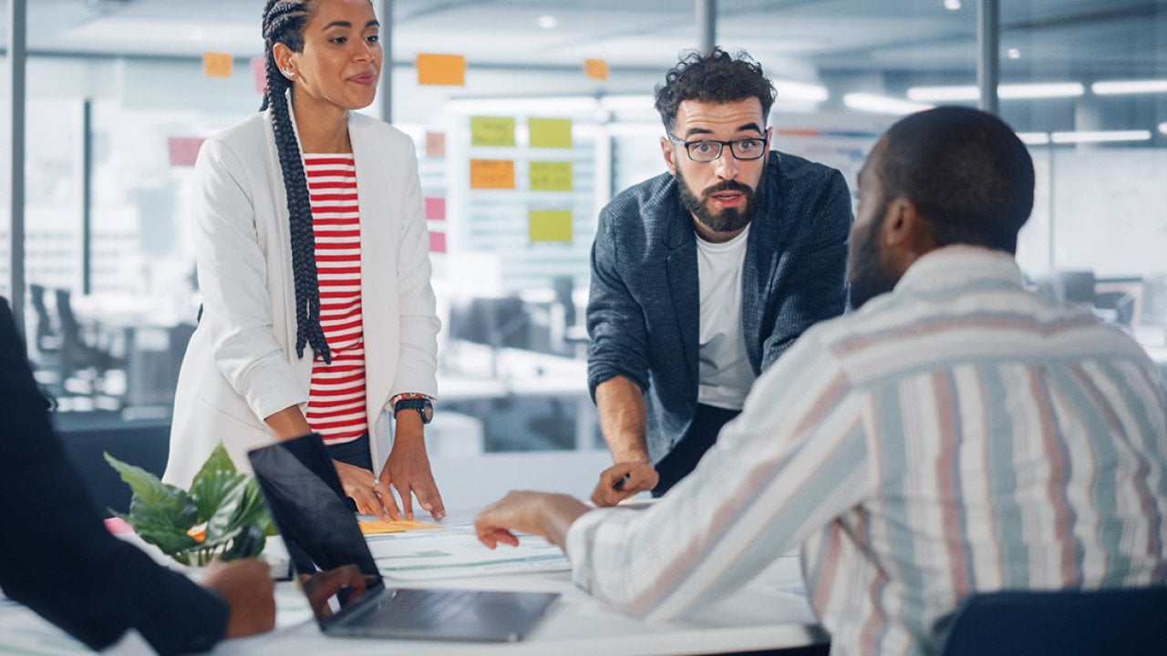 A diverse business group having a meeting in a modern office.