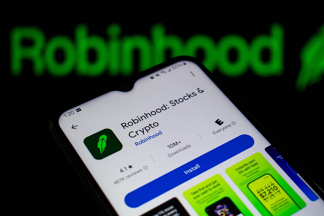 Robinhood, a financial investing app, and its logo displayed on a smartphone.