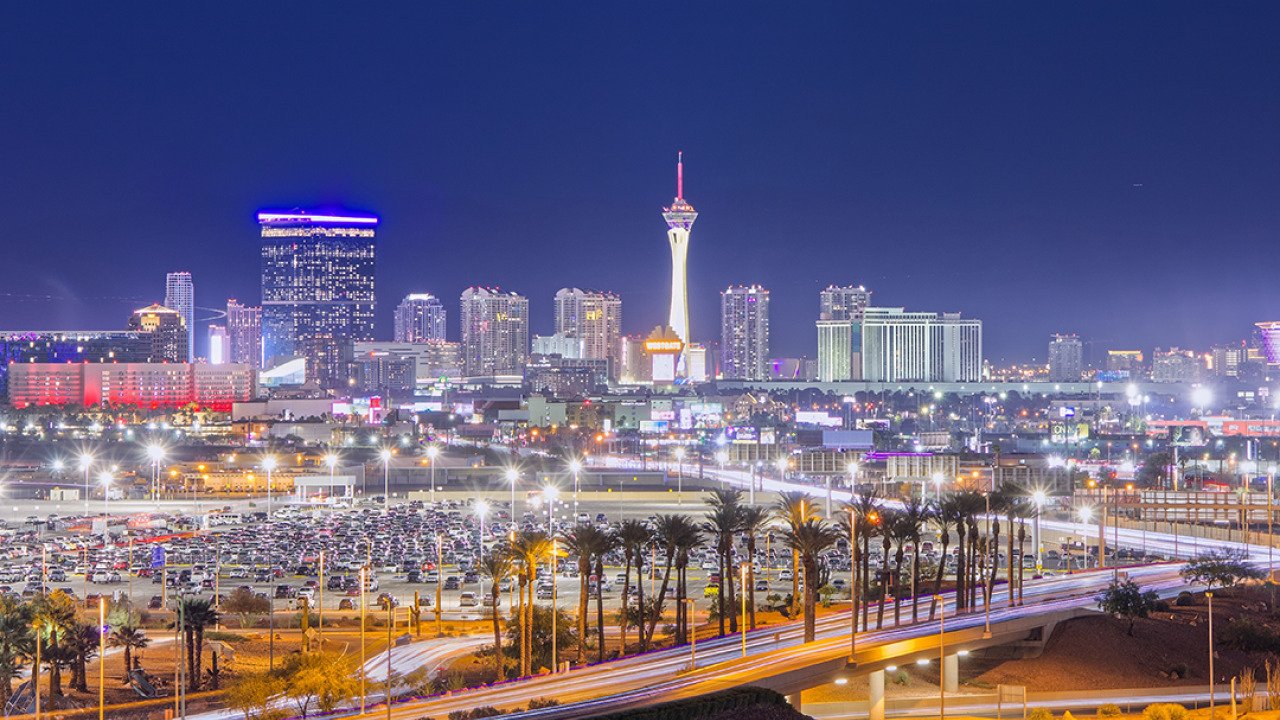 A view of the Las Vegas skyline as seen from Harry Reid Airport at night.