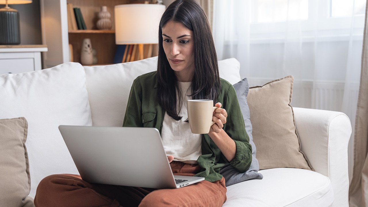 A person checking through her earnings from an online business in a laptop.