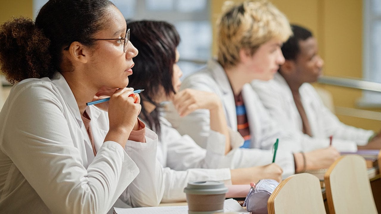 Medical students listening to a lecture at a university.