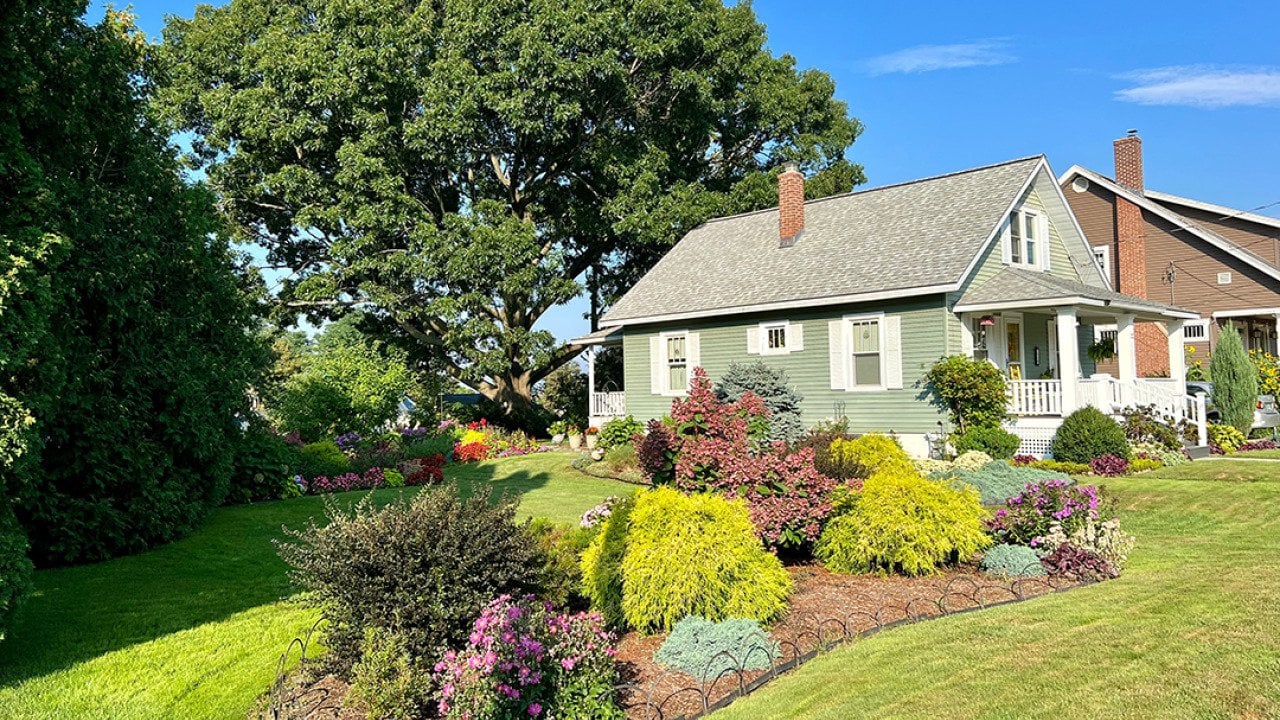A home with a beautifully manicured lawn.