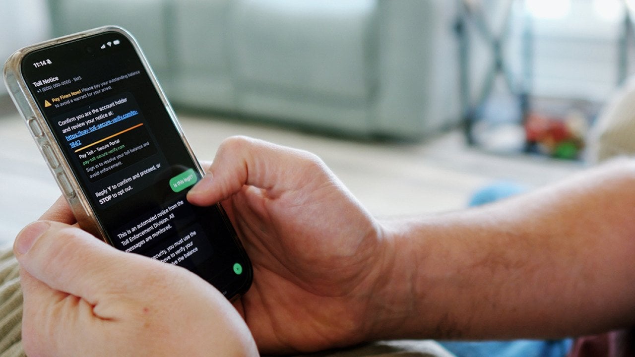 An automated scam text message displayed from a person's smartphone.