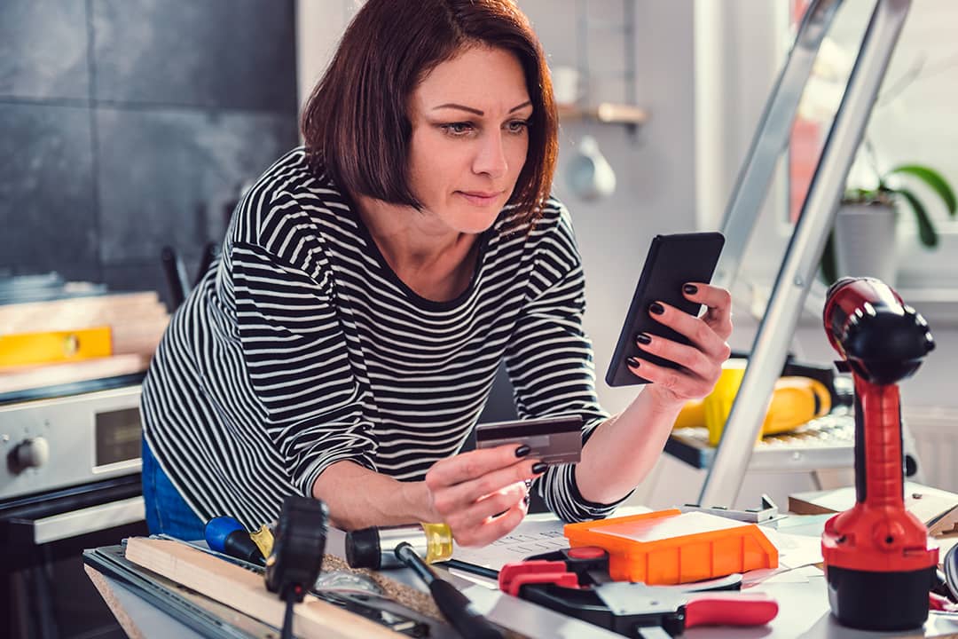 A person shopping for additional construction materials online after a kitchen renovation.