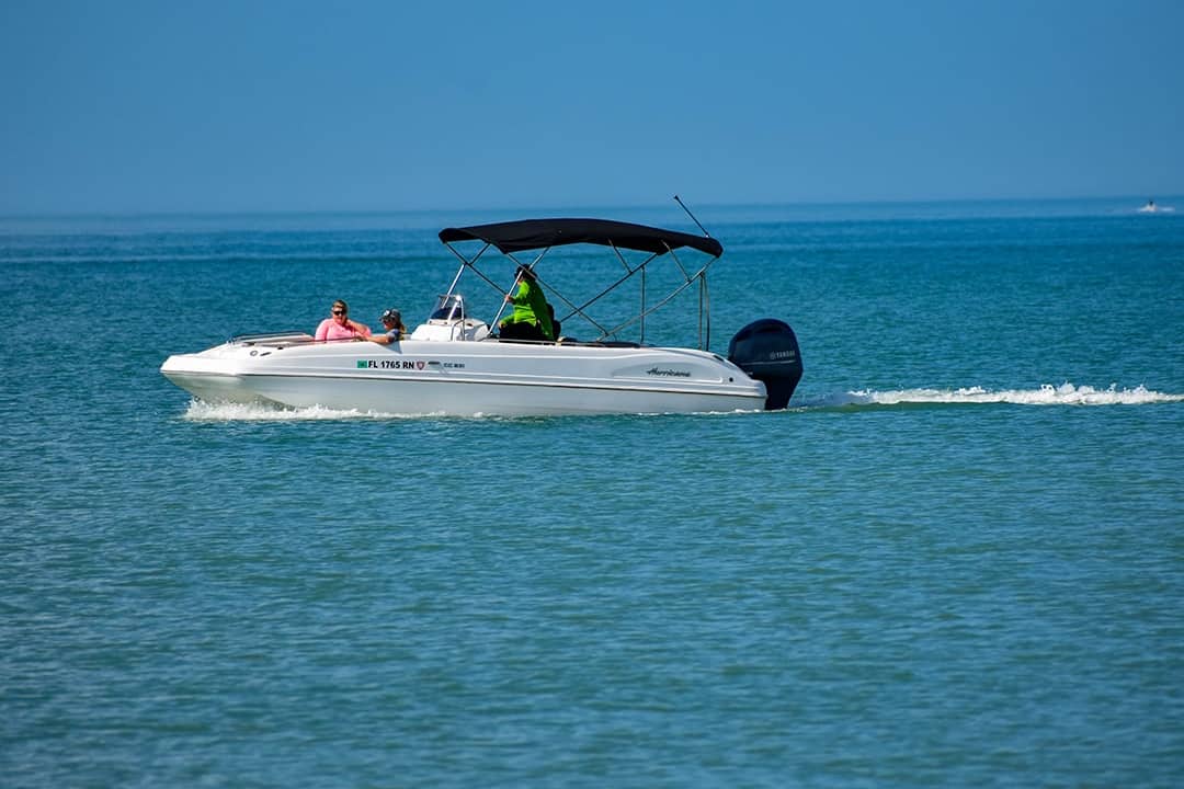 People enjoying bowrider boat ride in the Clearwater Beach in Florida, USA.