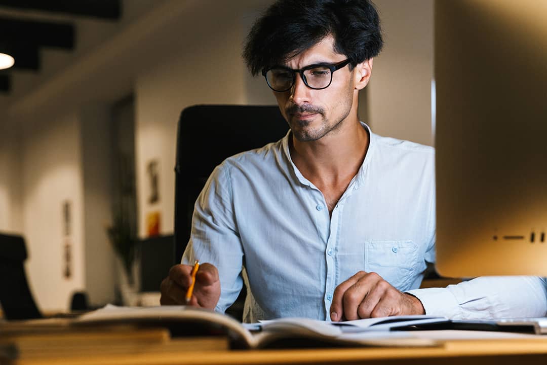 A focused businessman working at night.