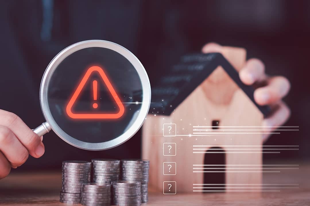 A financial analyst evaluating mortgage risk and housing uncertainty with miniature concepts. 