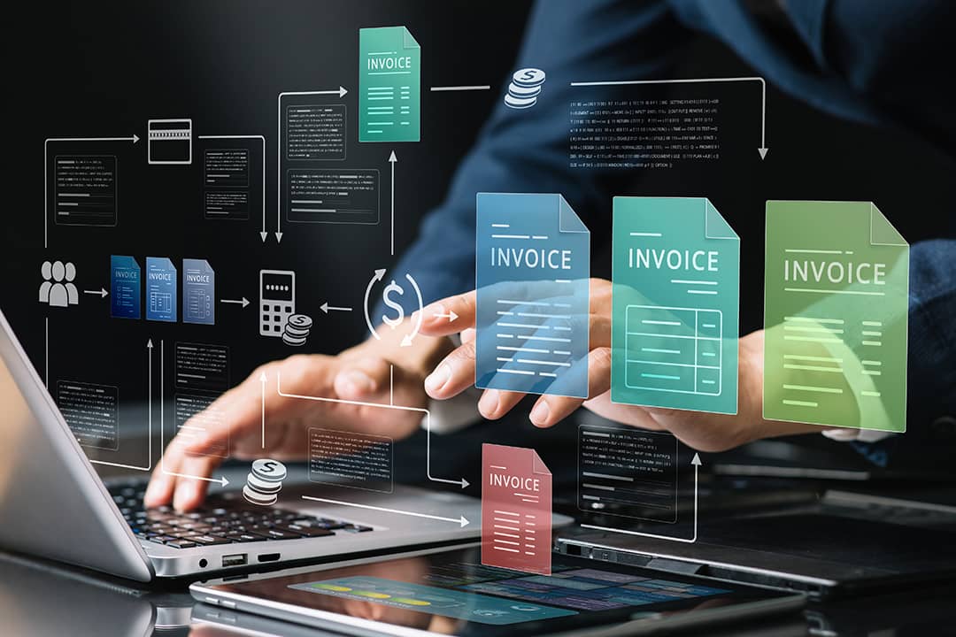 Businessman using a laptop illustrated with invoice and finance software tool graphics.