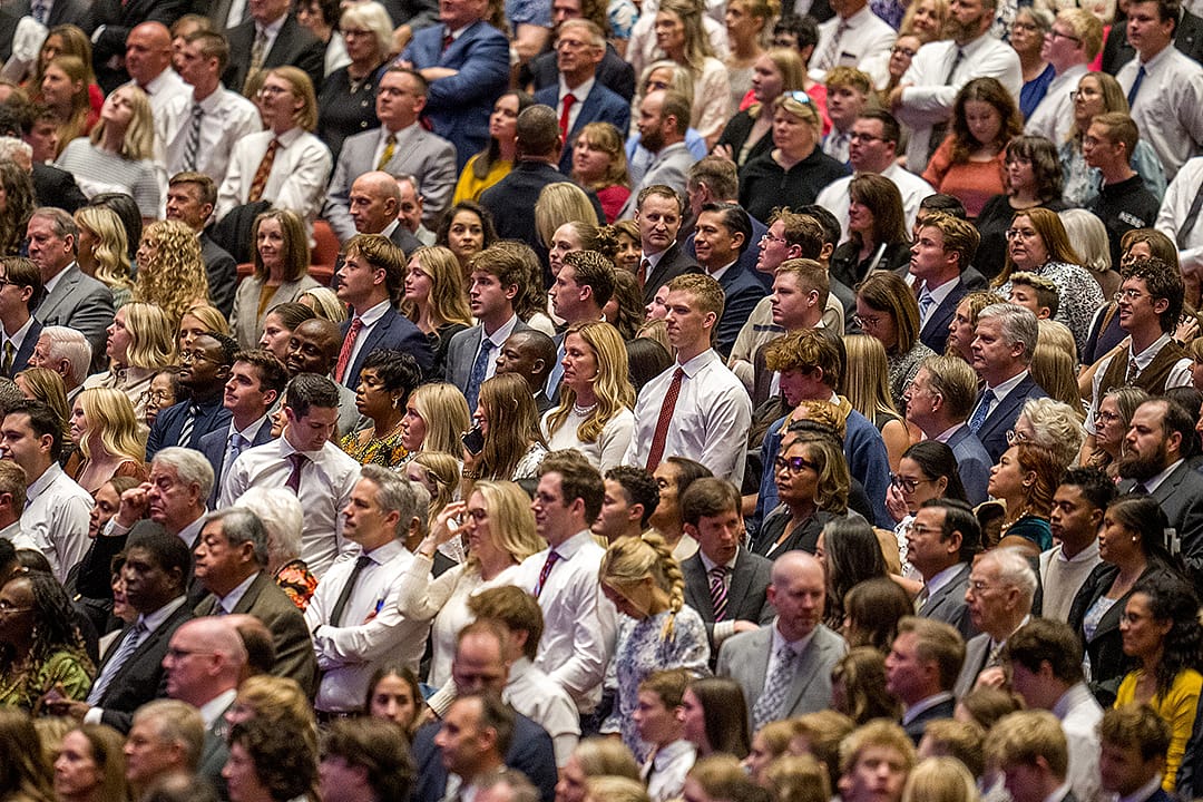 Attendees stand at the start of a General Conference session in 2025. Latter-day Saint retention has emerged as an issue in the global faith in the wake of recent research.