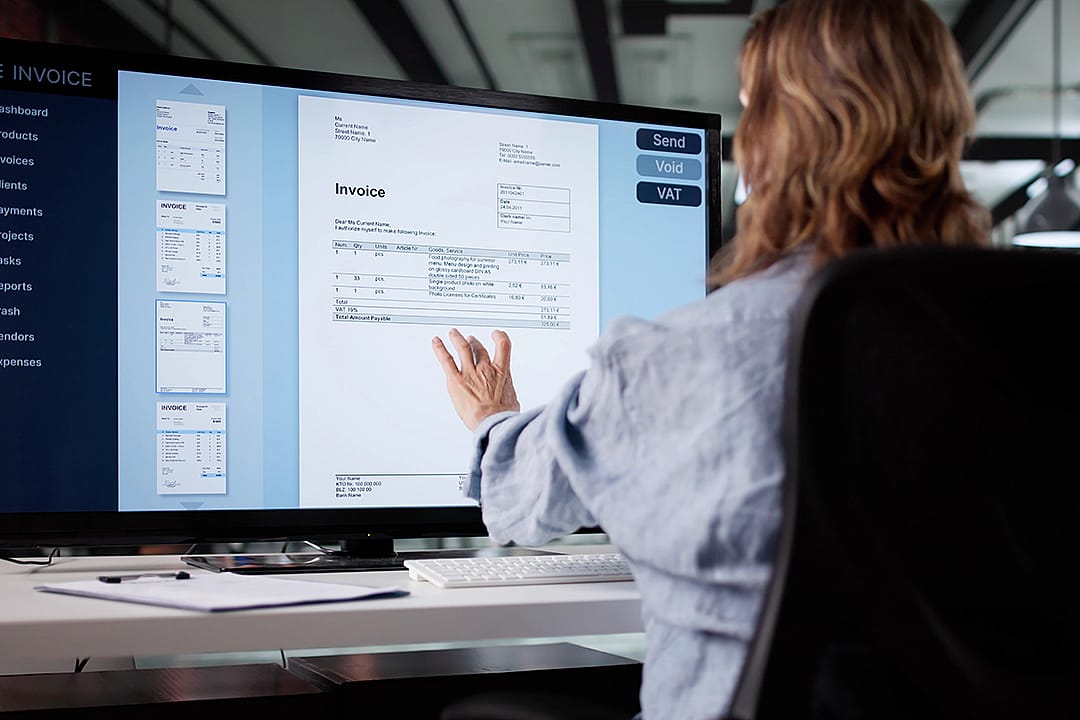 An accountant working on an invoice system.