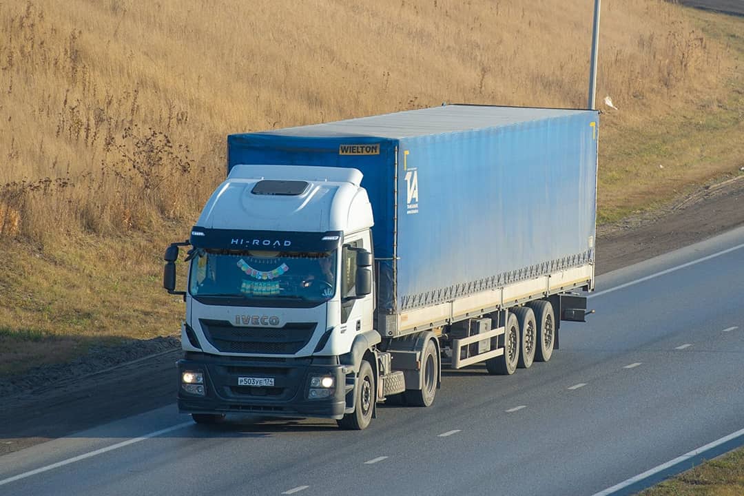 A freight truck on a highway 