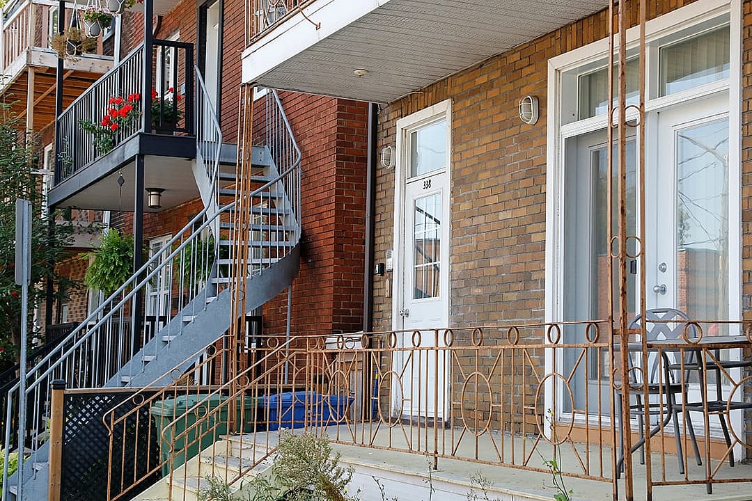 An exterior staircase seen from a residential building in town. 