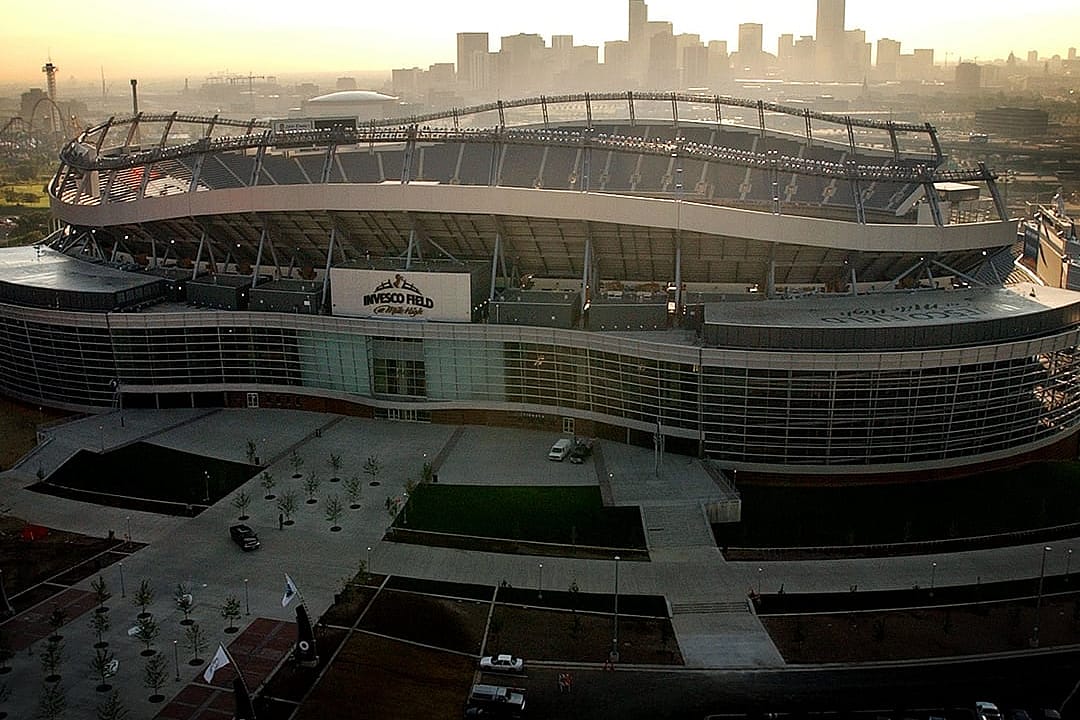 Aerial view of the new Mile High stadium with the Denver skyline in the background.