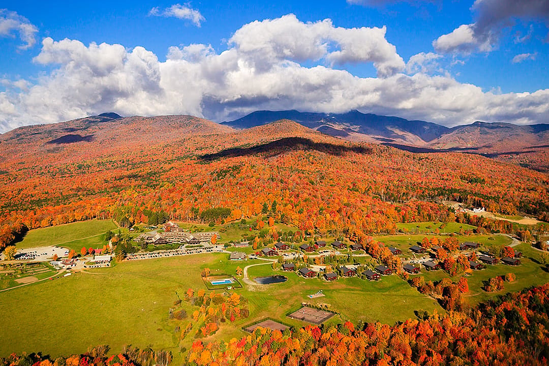 An aerial view of the Trapp Family Lodge with a view of Mount Mansfield in Austria.