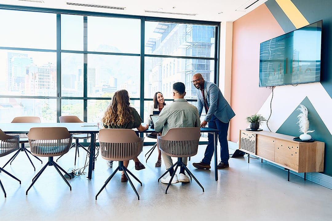 A business team in a modern office meeting room.