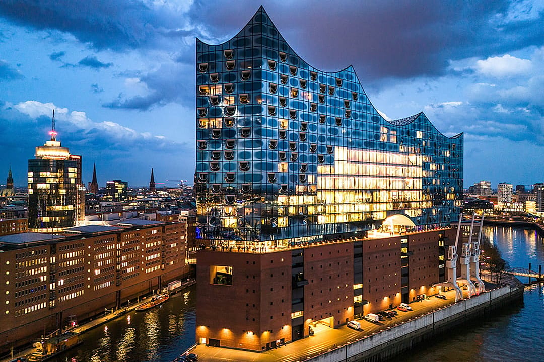 Exterior of Elbphilharmonie Hamburg concert hall at dusk.