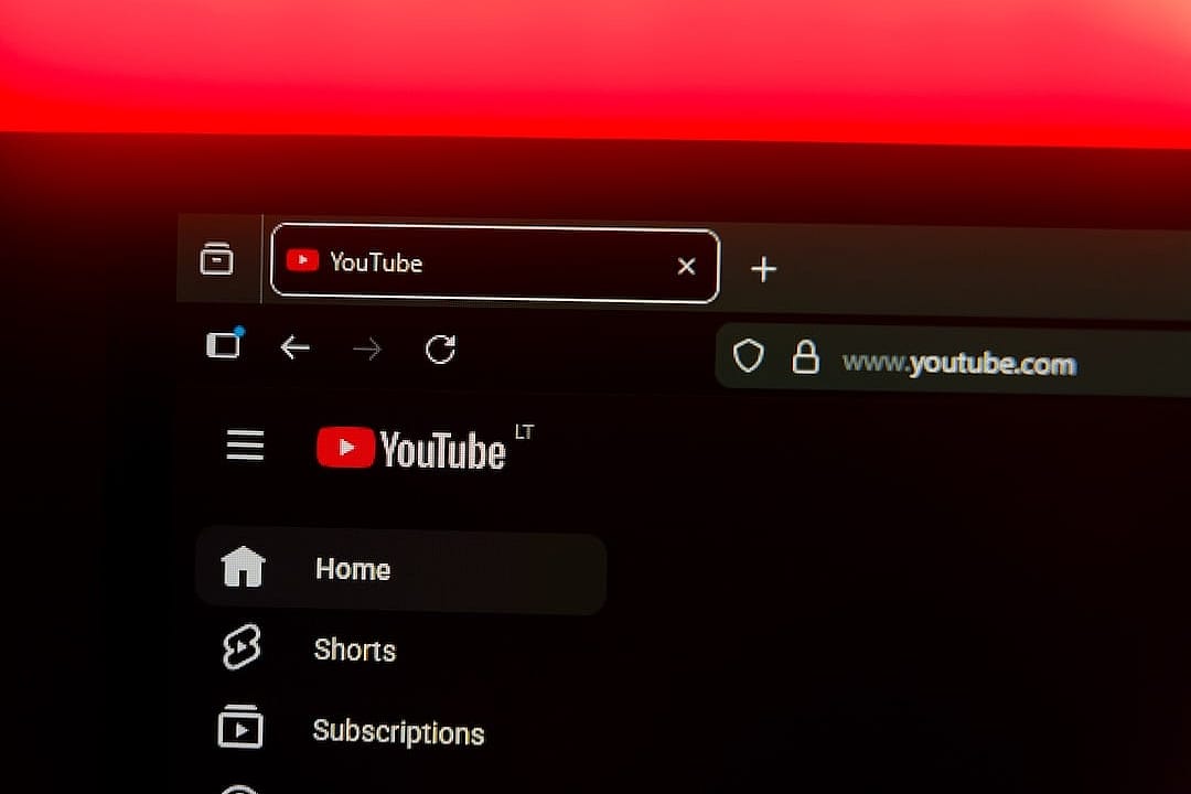 Close up on a web browser displaying the YouTube logo and home menu.