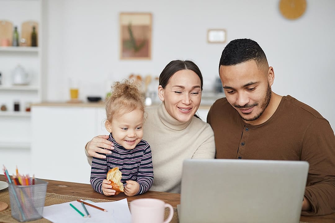 A happy family online shopping at home.