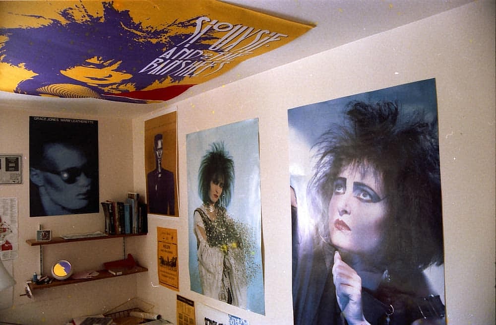 A dorm room covered in Grace Jones and Siouxsie and the Banshees posters