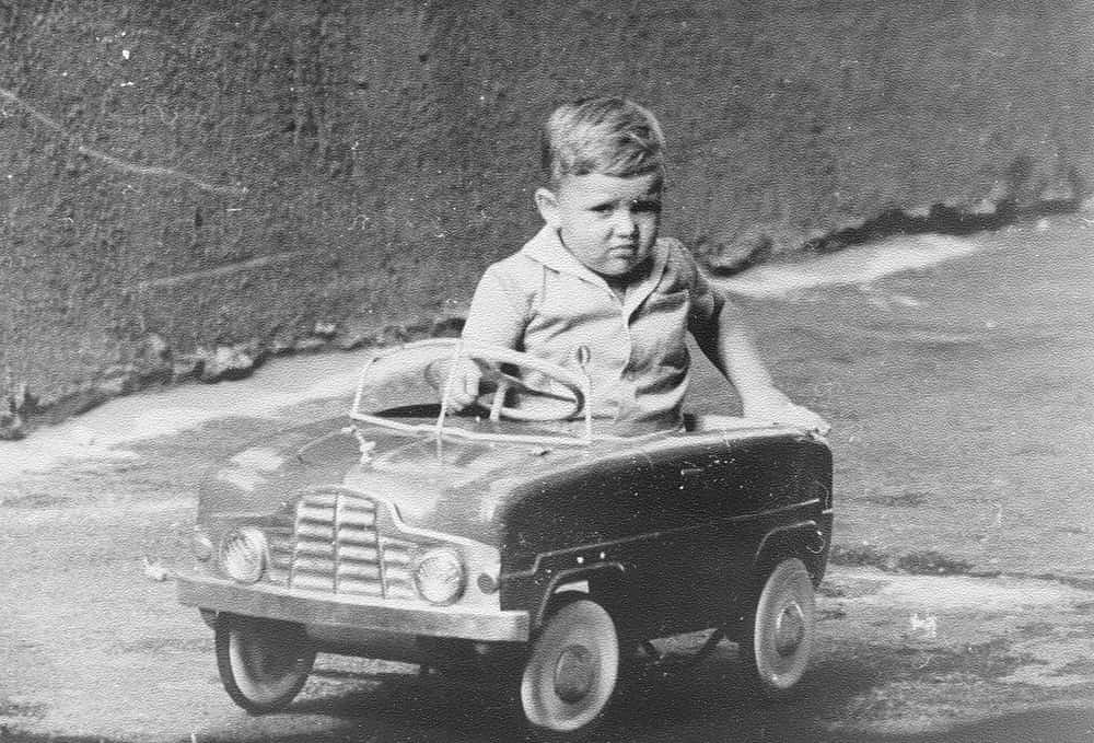 1967: A little boy is driving a big toy car.