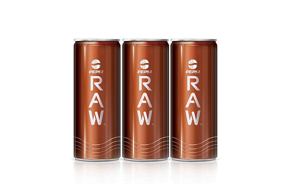 Three cans of Pepsi Raw