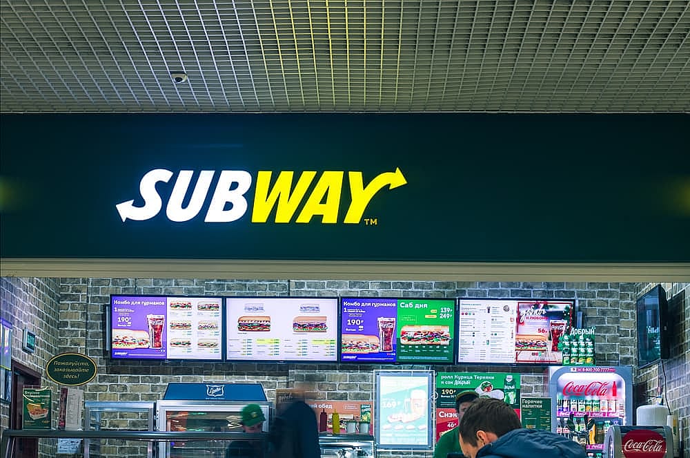 People stands in the Subway fast food restaurant