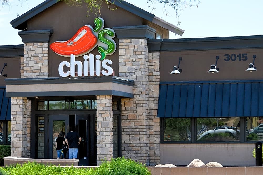 Customers entering a Chili's Grill and  Bar,  an American casual dining restaurant chain.
