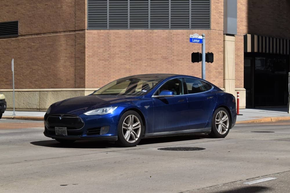 A blue Tesla Models 4DR luxury EV sedan.