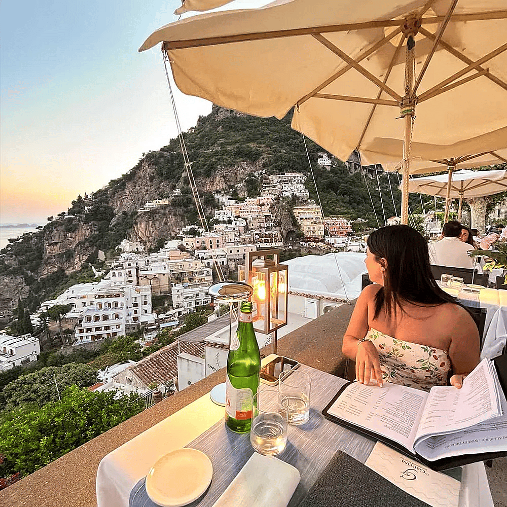 A stunning view of the Amalfi Coast and sunset from a restaurant in Italy.