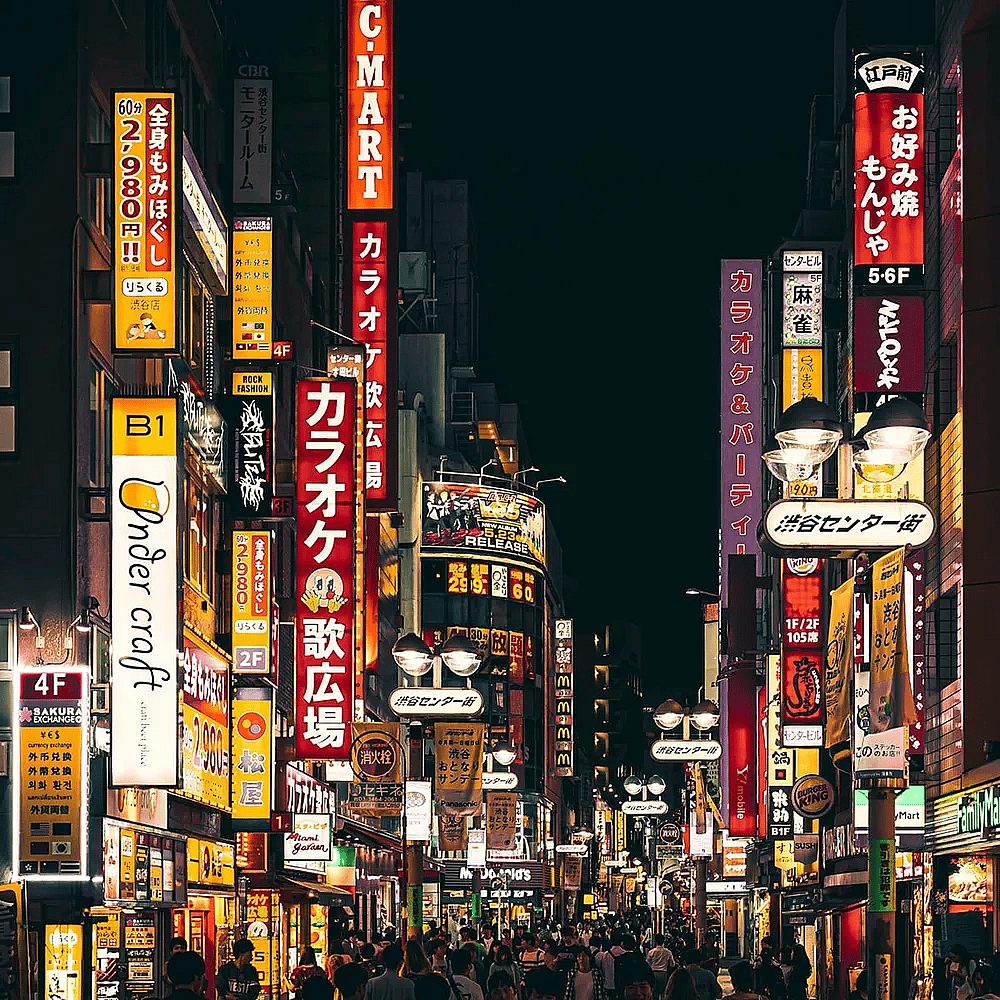 Bright and neon-light streets of commercial shops and stores in Tokyo, Japan.