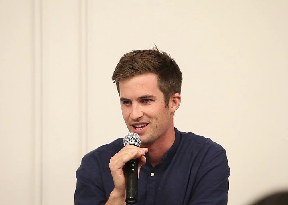 William Hockey with a microphone.