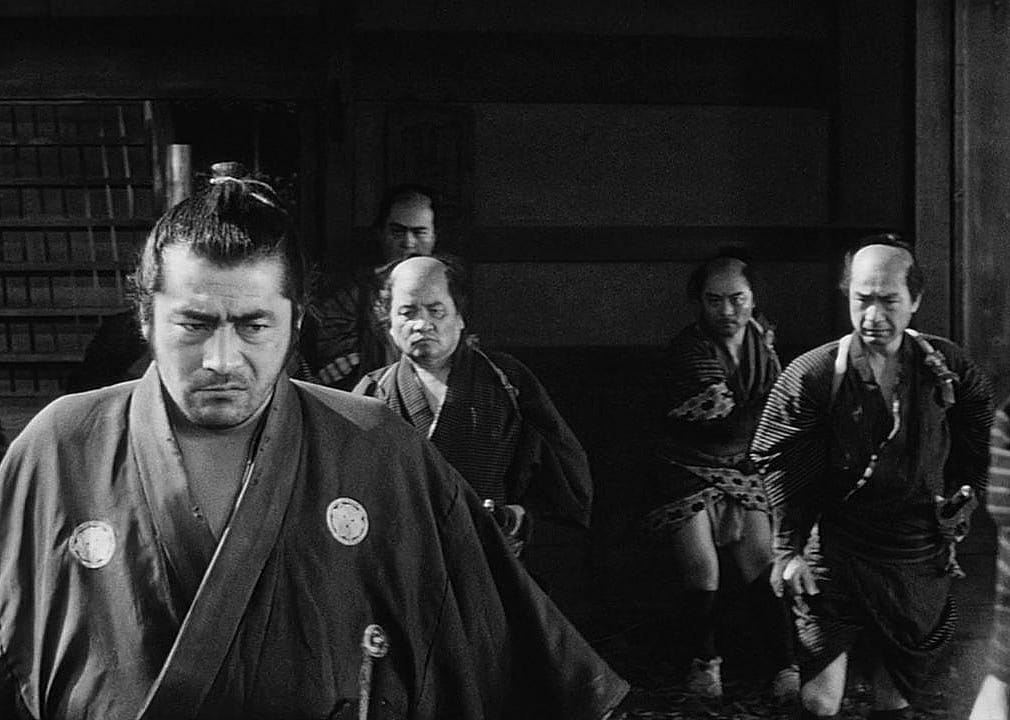 Actors in a scene from ‘Yojimbo’.