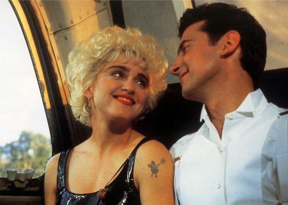 Madonna looking longingly at a man.
