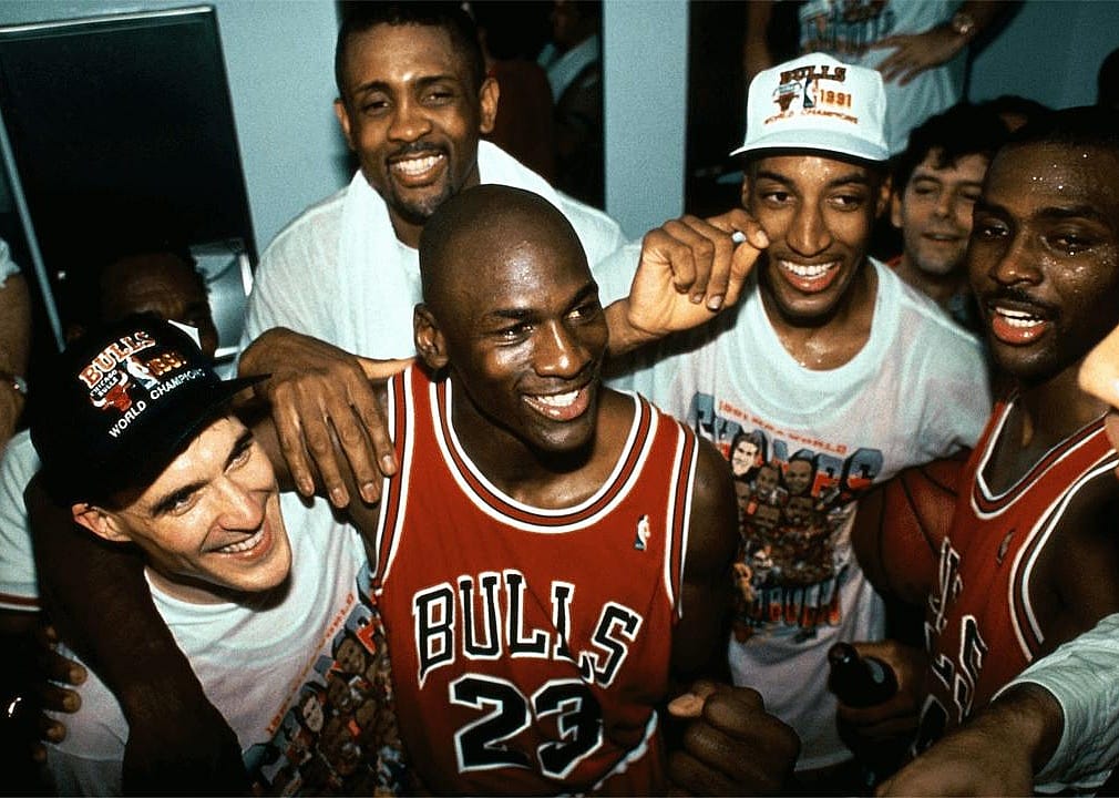 Michael Jordan, Scottie Pippen, Horace Grant, and John Paxson after a game.