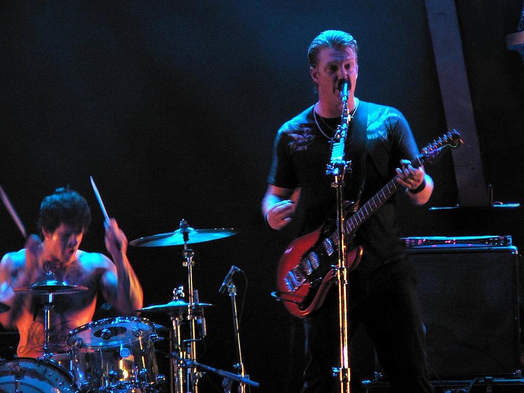 #34. Queens of the Stone Age (tie)