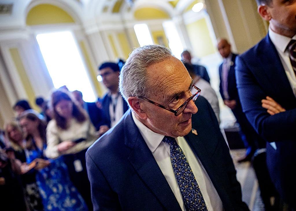 Senate Minority Leader Chuck Schumer (D-NY) walks back onto the Senate floor after speaking to reporters at the U.S. Capitol Building in Washington, DC.