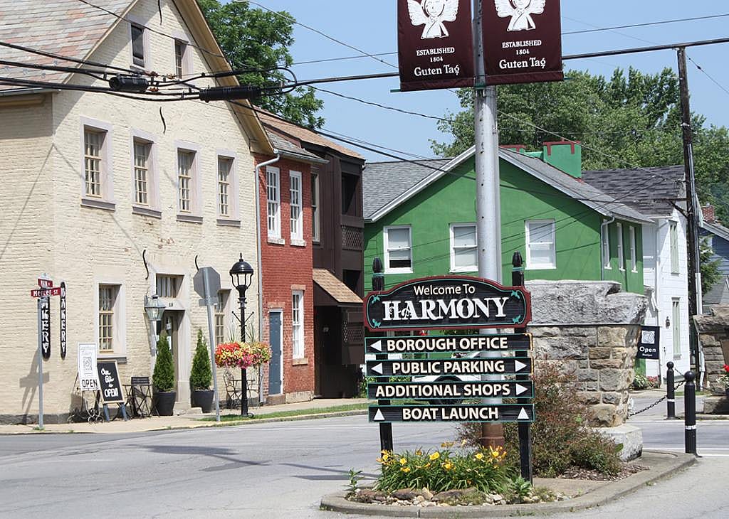 A street view of the 'Welcome to Harmony' sign in Pennsylvania.