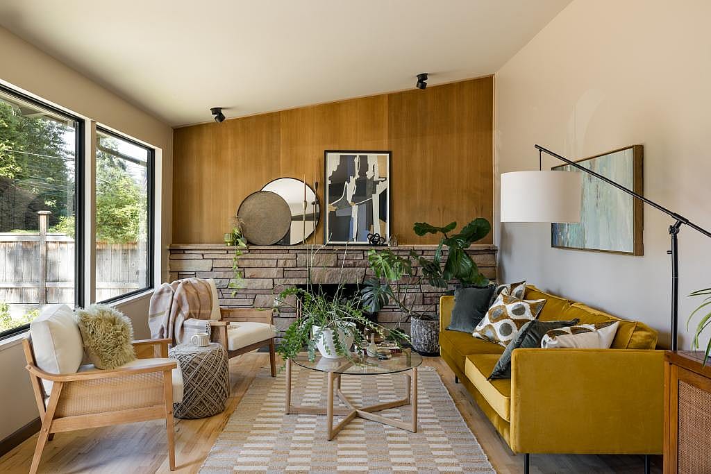 Interior of a modern living room with warm yellow accents.