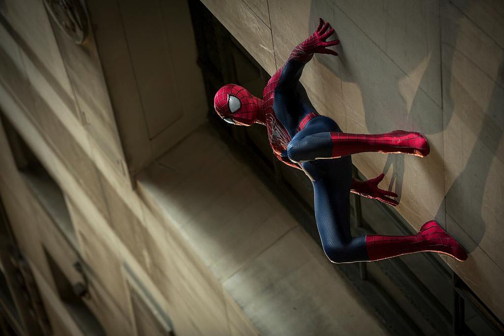 Spiderman clinging to a wall