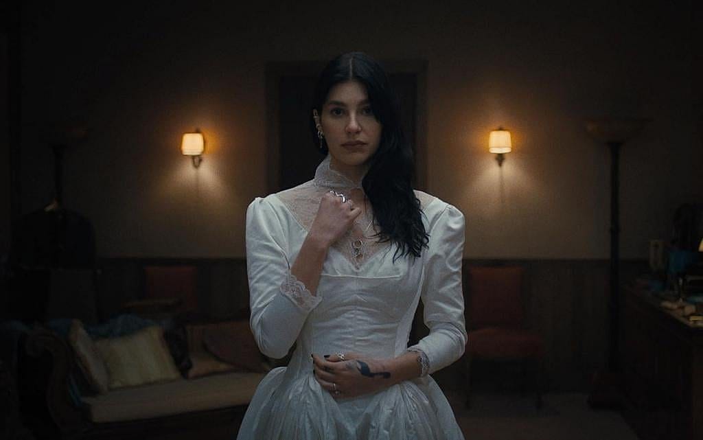 Camila Morrone wearing a wedding dress in Something Bad is Going to Happen