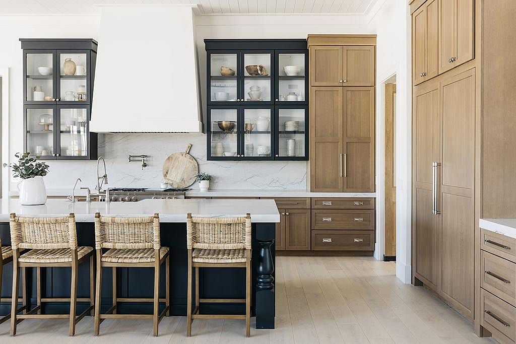 Modern luxury kitchen with glass-front cabinet doors.